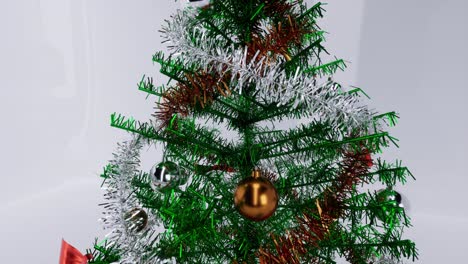 christmas tree with gold and silver balls, ornaments, and a glowing star, on white glossy background