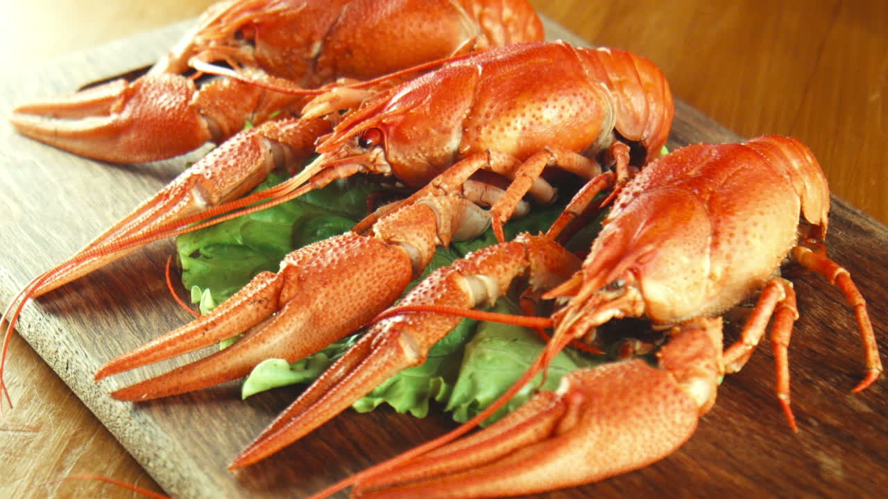 Grilled Crayfish with Salad on Wooden Board