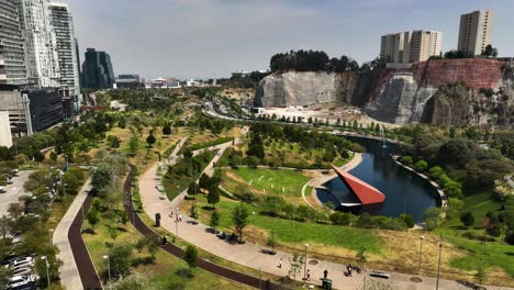 aerial view flying around the la mexicana park, sunny day in santa fe, mexico city