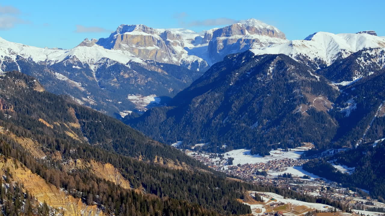 Aerial drone view of snow on the mountains in the Dolomites, Italy