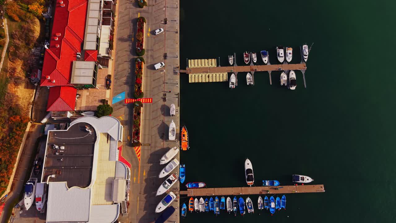 Aerial view of boat marina near waterfront in Bulgaria during autumn