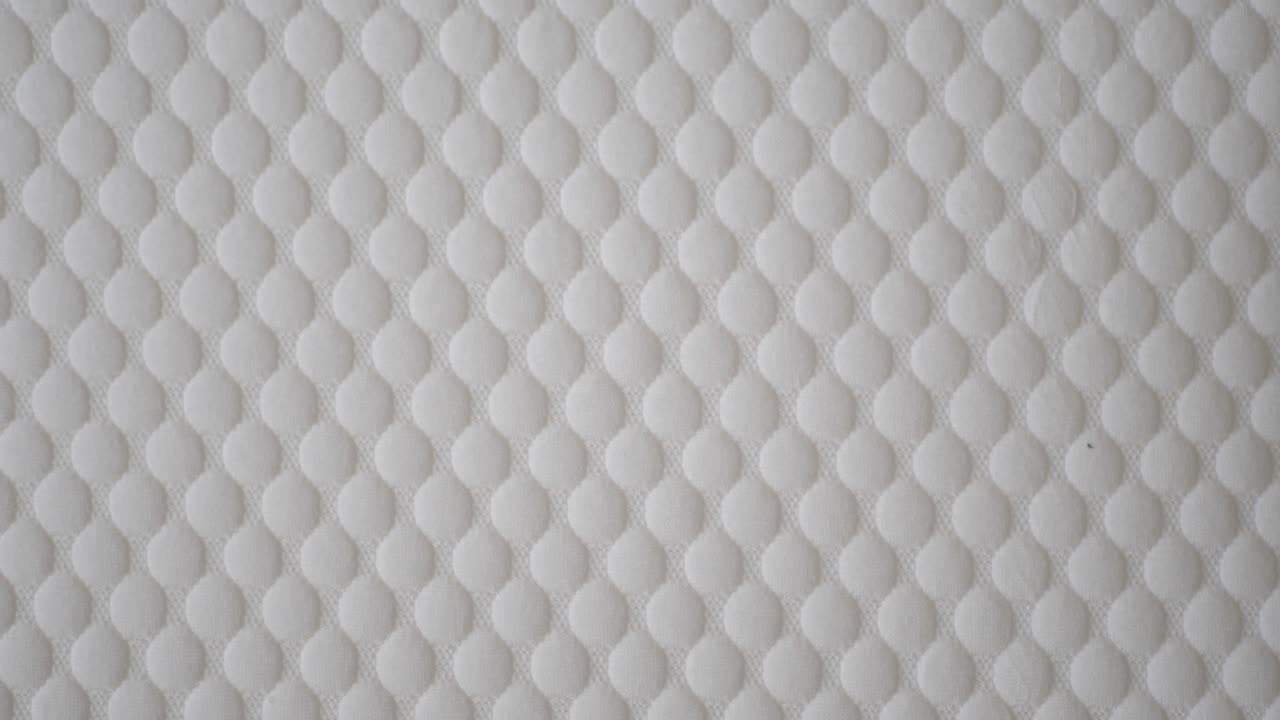 textura de tela acolchada blanca