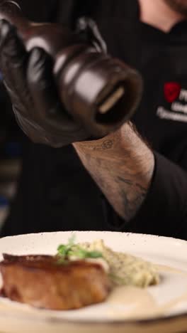 chef seasoning a delicious steak