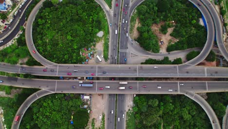 vehicles moving on maduravoyal bypass flyover at ambedkar nagar, mumbai highway, chennai, tamil nadu, india. day time, top view, drone shot, 4k.