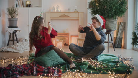 Woman-photographing-male-friend-through-camera