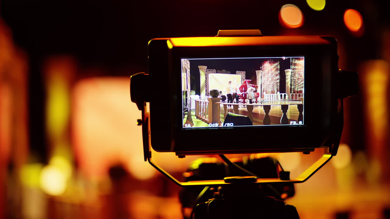 Professional camera filming with on the backstage of a TV set