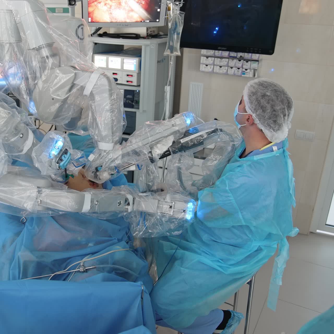 Medical operation involving robot.. Team of Professional Surgeons perform a Delicate Operation using Medical Surgical Robot