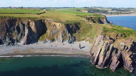 beach under the cliff in ireland in a summer day