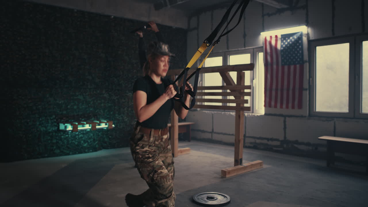Female Soldier Doing Suspension Training Exercises