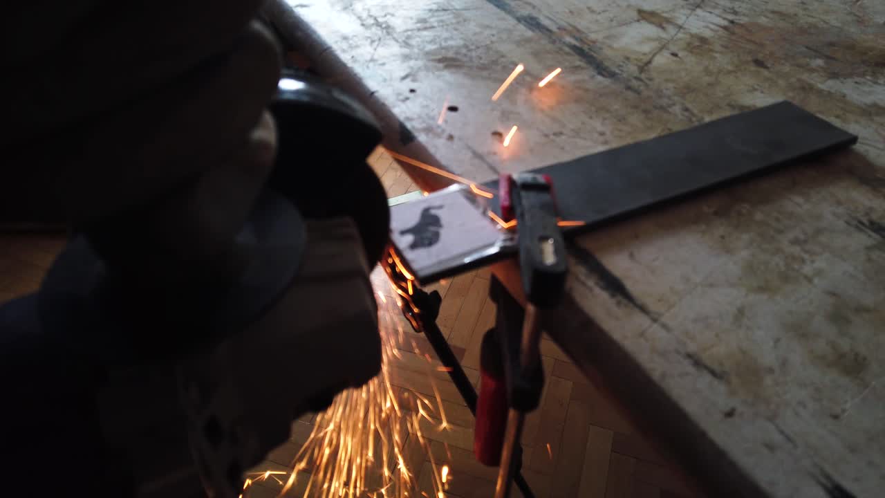 Cinematic closeup blur footage of cutting steal with angle grinder