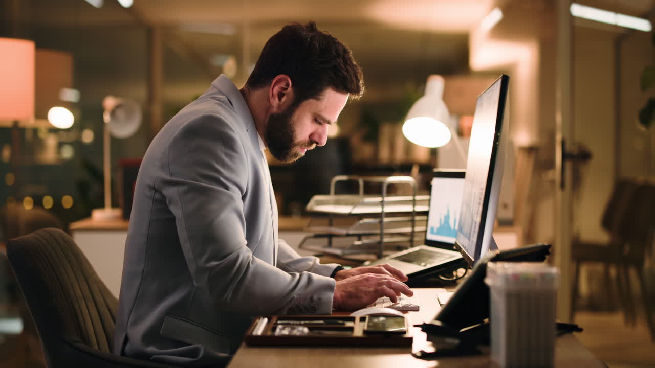 Man working at desk with computer in office