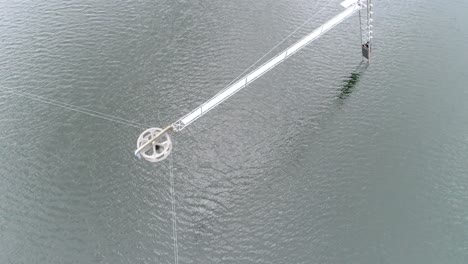 drone shot of the mechanic pulling poles at a watersport park