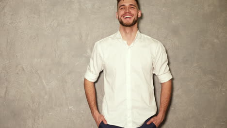 smiling man in a white shirt