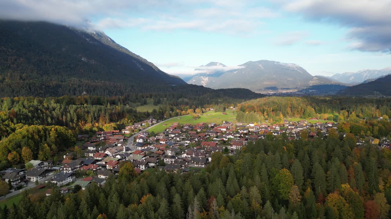 Aerial view of the colorful autumn scenery around the small town of Grainau in Bavaria with the peak of Wank in the Ester mountain range in the background