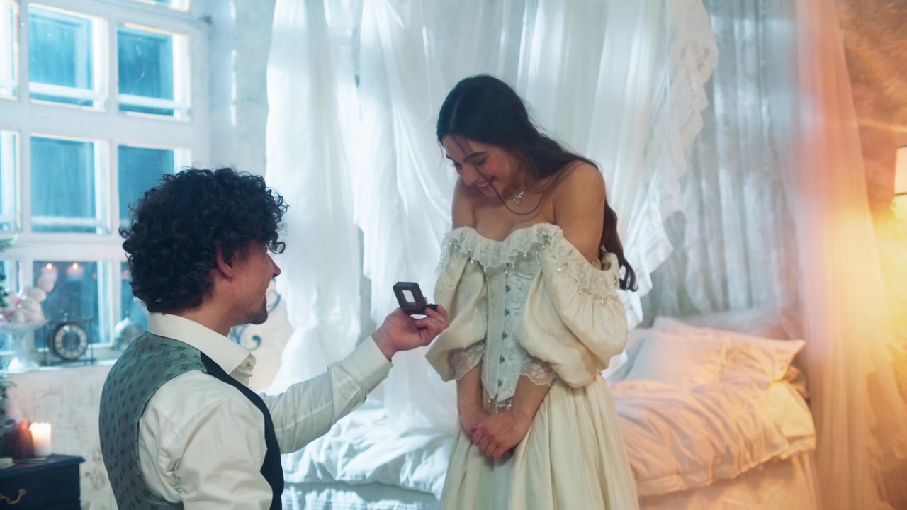 Man Kneeling and Proposing Marriage to a Happy Woman