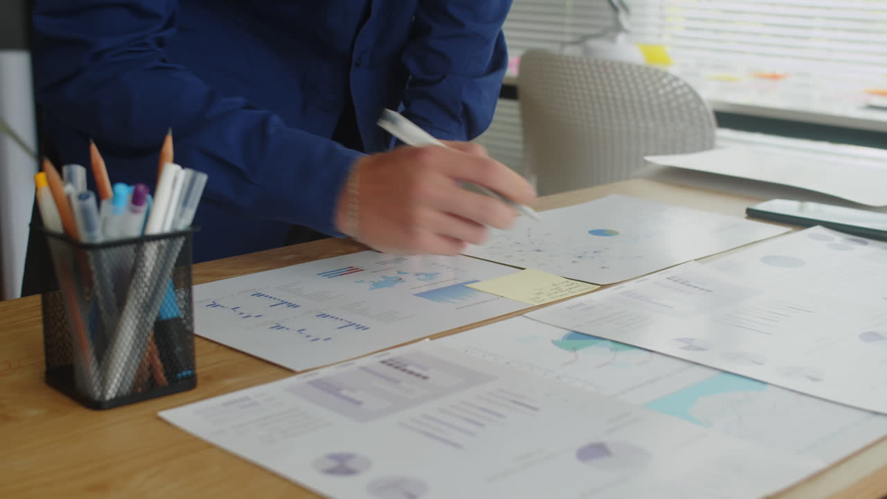 Businessman Preparing Project Analysis on Paper