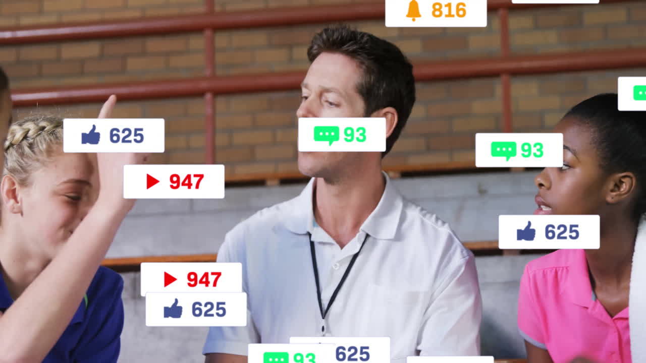 Coach chatting with athletes on gym bleachers, displaying floating social media icons for marketing