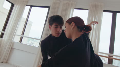 beautiful duet performing sensual contemporary dance on rehearsal