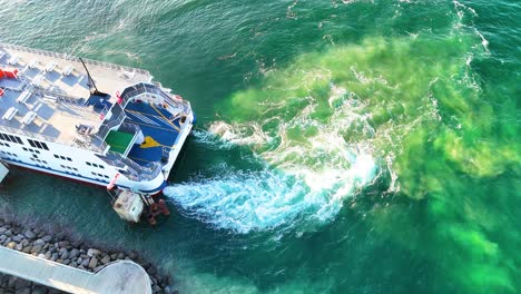 Aerial footage of a ferry docking at Bellarine Peninsula, showcasing vibrant water movement and dynamic lighting