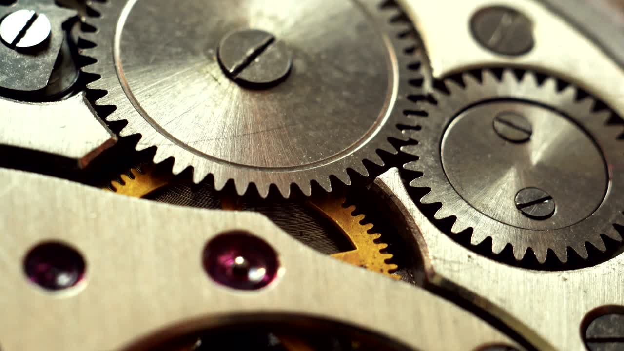 dos engranajes giran, en bucle, cerca