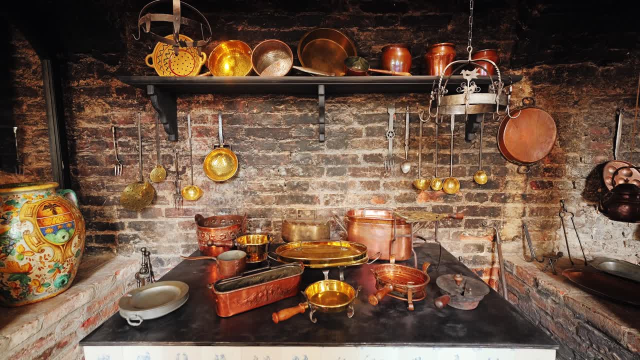 Baroque castle kitchen with rustic cookware, aged brick wall and hanging pans