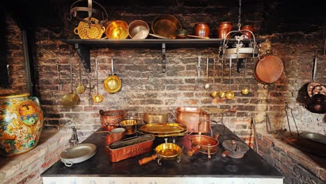 baroque castle kitchen with rustic cookware, aged brick wall and hanging pans