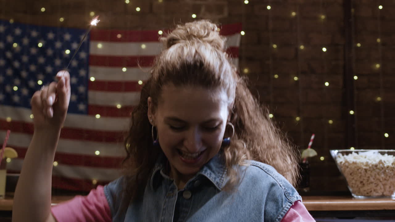 Woman celebrating the Fourth of July with sparklers