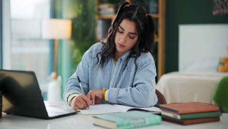 a woman studying at her desk
