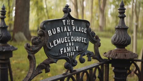 pan around of the sign at final resting place of lemuel durfee senior and family in the 1800s in early palmyra