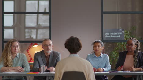 team of recruiters interviewing job candidate