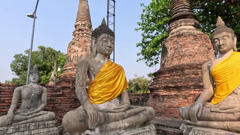 a panoramic view of buddha statues in ruins