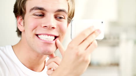 Attractive-young-man-video-messaging