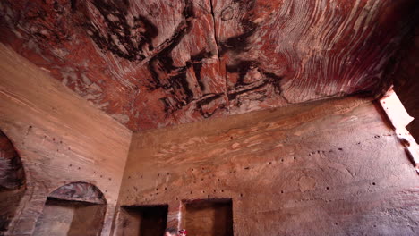 interior chamber of urn tomb of the royal tombs with niches carved out in the stone in ancient city of petra