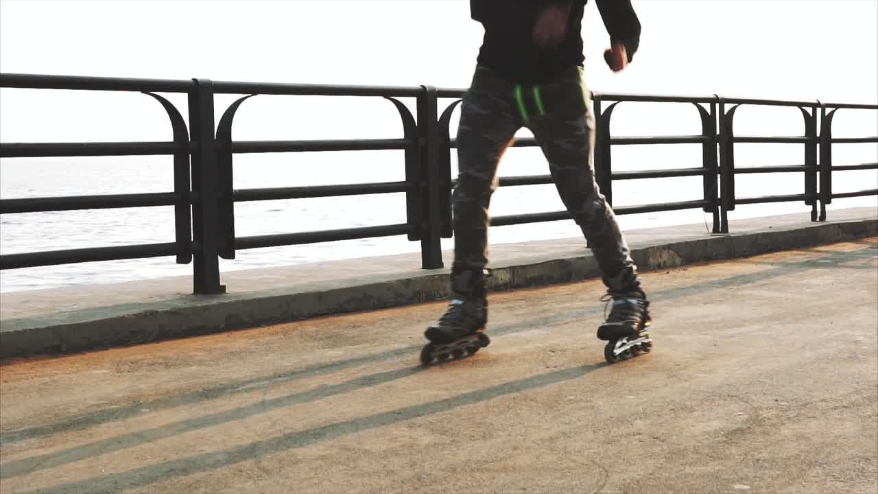 Person Rollerblading at the Coastal Bridge
