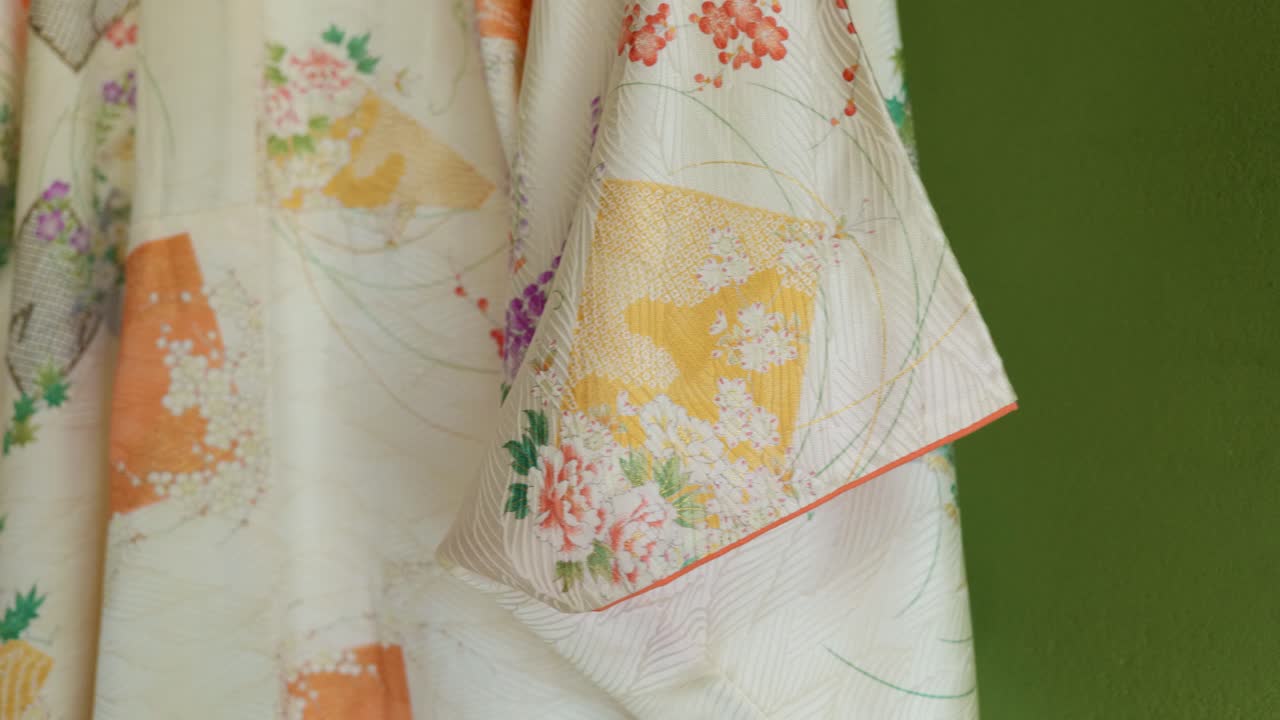 A Traditional Japanese Kimono for a Woman Hanging in an Old Traditional Japanese House