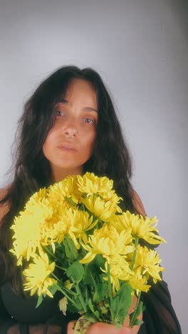 woman with a bouquet of yellow flowers