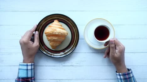 breakfast with croissant and coffee