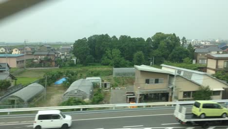 Look-outside-the-window-of-a-shinkazen-train-in-japan