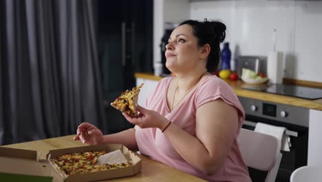 overweighted woman eats with great pleasure, woman eats pizza, rolls eyes