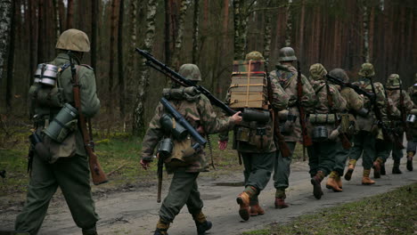 german soldiers marching in wwii reenactment