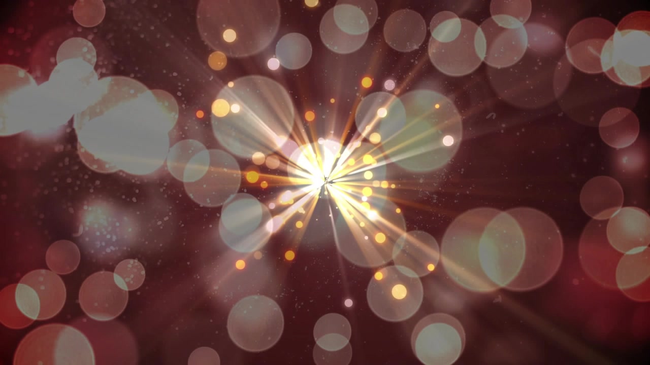 Nucleo luminoso che inizia come un punto brillante, pulsante e che emette raggi verso l'esterno, scintille dorate che mostrano energia.