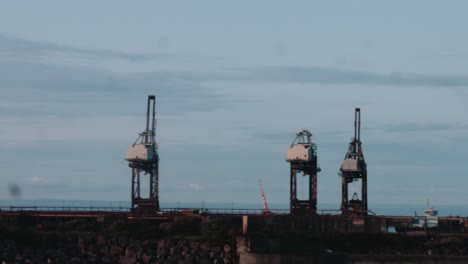 cinematic pan across harbour and industrial site