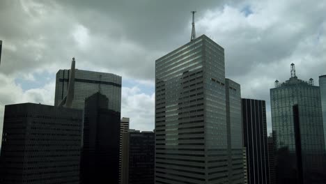time lapse of clouds passing by quickly over downtown dallas, texas with camera zoom out