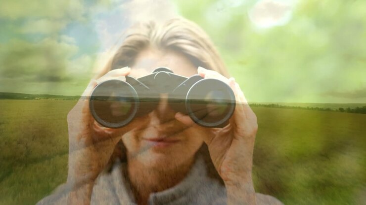 Woman using binoculars over scenic landscape, exploring nature animation