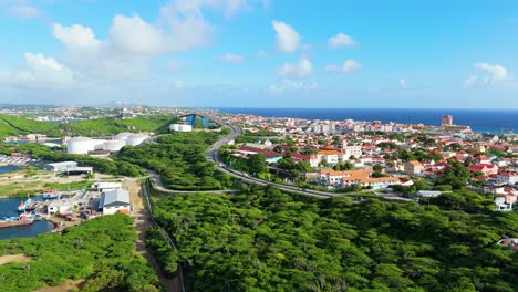 panoramic wide angle of winding road leading up to queen juliana bridge curacao