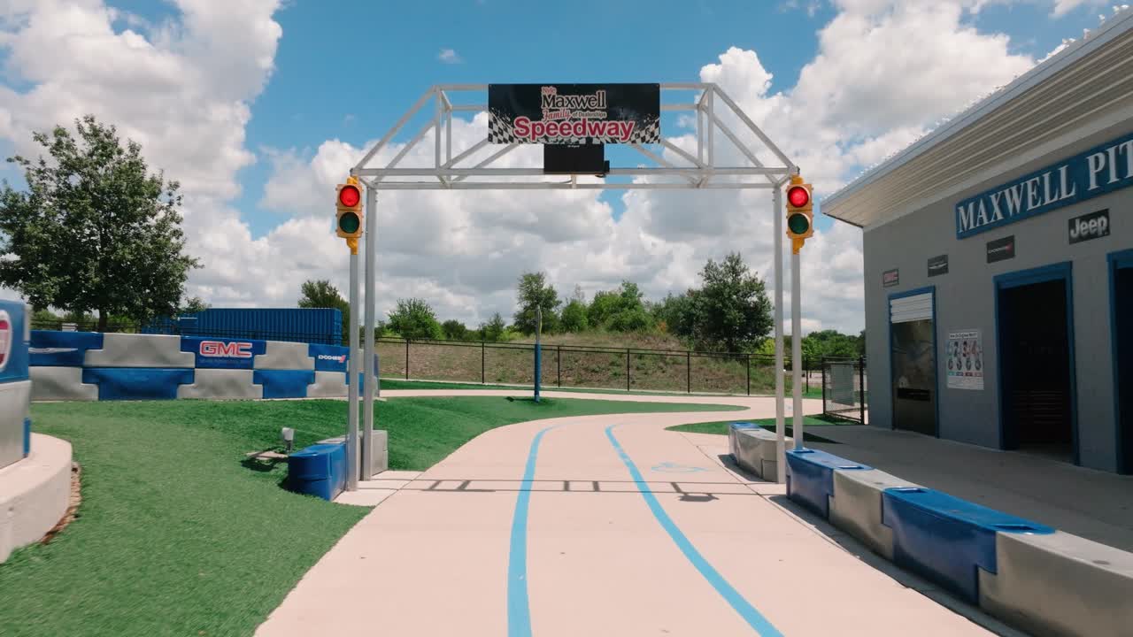 Round Rock Play for all park Maxwell Speedway aerial flythrough gate on race track in 4k