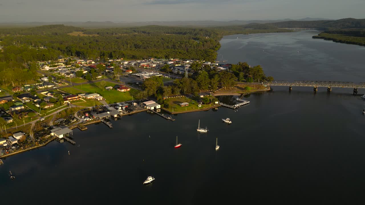 Right to left sunrise, aerial views in the regional town of Karuah, New South Wales, Australia.