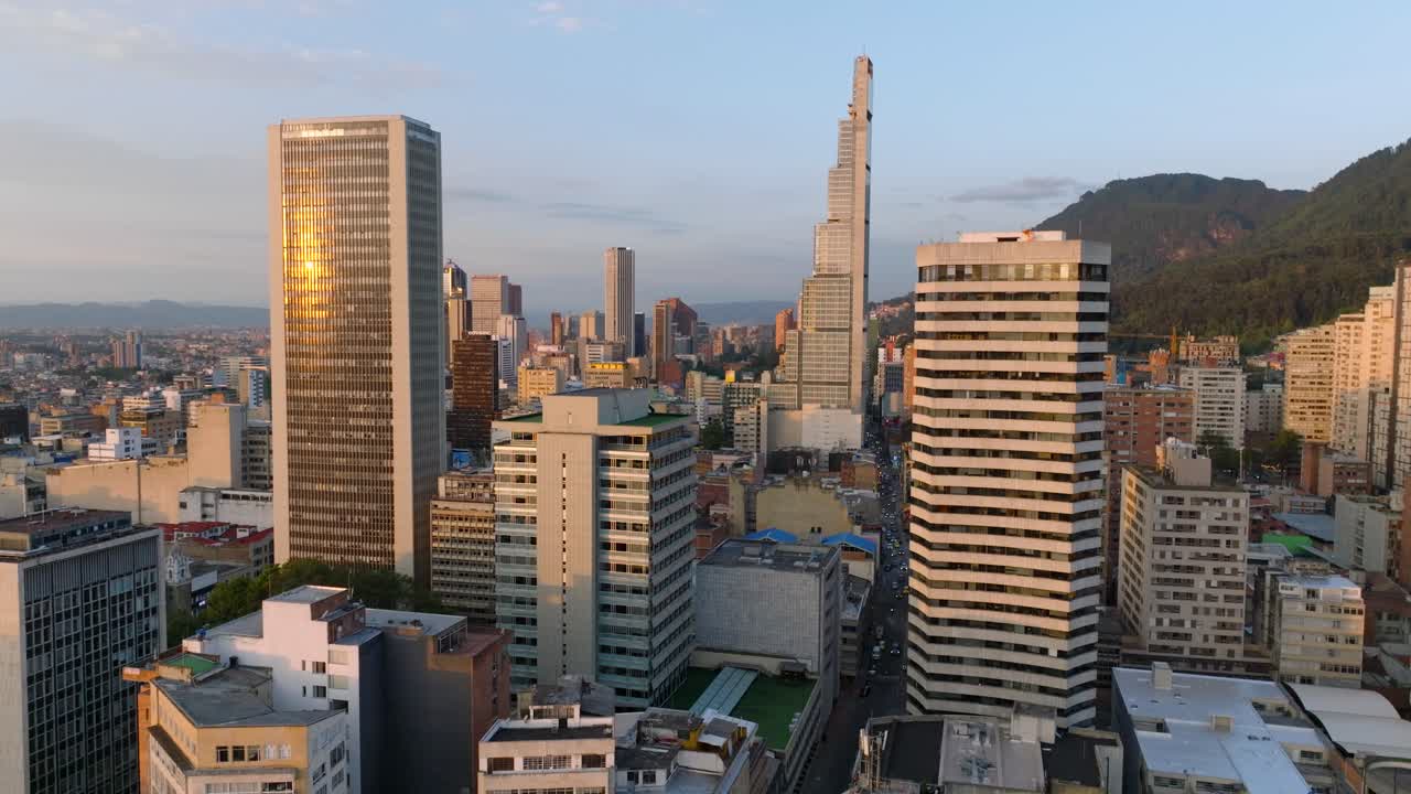 Drone shot over Bogota city center at sunset