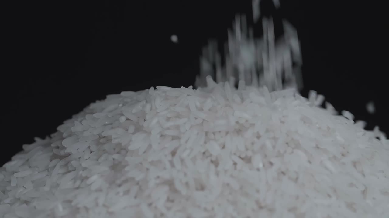 Close Up Of White Rice Falling And Move Around | Premium Stock Video ...