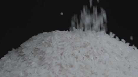 close up of white rice falling and move around